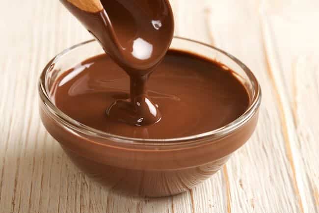 a bowl of melted tempered chocolate from microwave