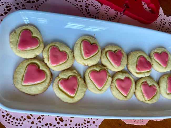 Heart Glazed Cornmeal Cookies on a white platter
