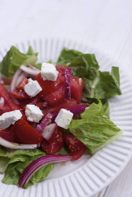 Fresh from Florida Tomatoes, watermelon onions and cheese create this refreshing Summer Tomato Watermelon salad. 