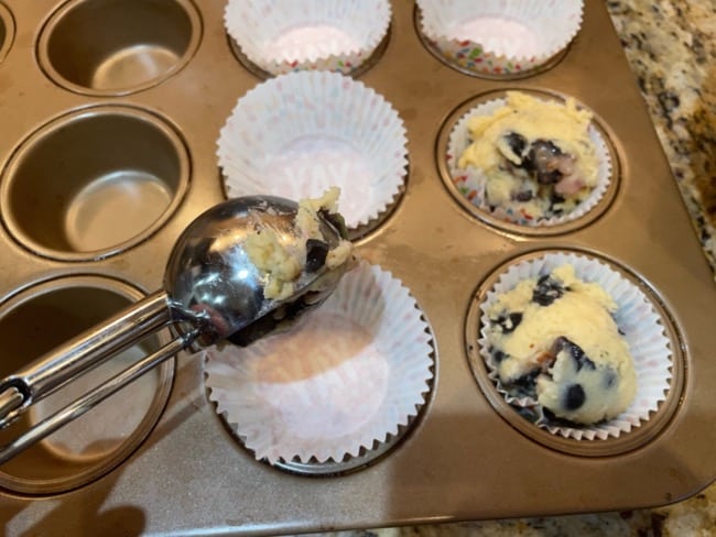 using ice cream scoop to put muffin batter