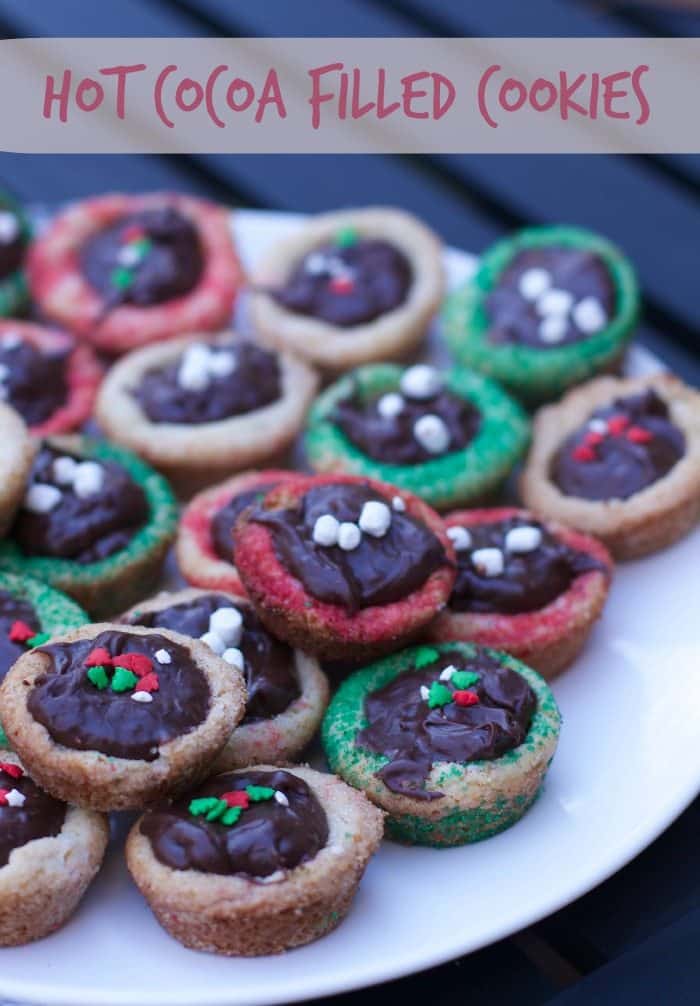 hot cocoa ganache filled sugar cookies on a plate