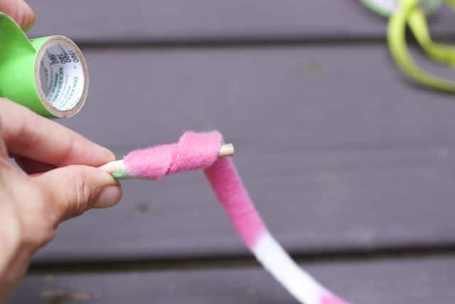 Make this super easy cat wand toy with stuff you have at home. 
