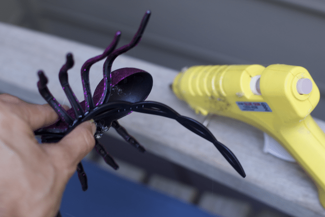 How to glue a plastic spider onto a headband with hot glue gun